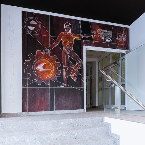 Linking yesterday and today. The 1972 chalk outline, Homotechnikus by Franz Kohler, rediscovered in the course of construction work, has a gleaming new look in the modern entrance area.(BRP-Rotax)